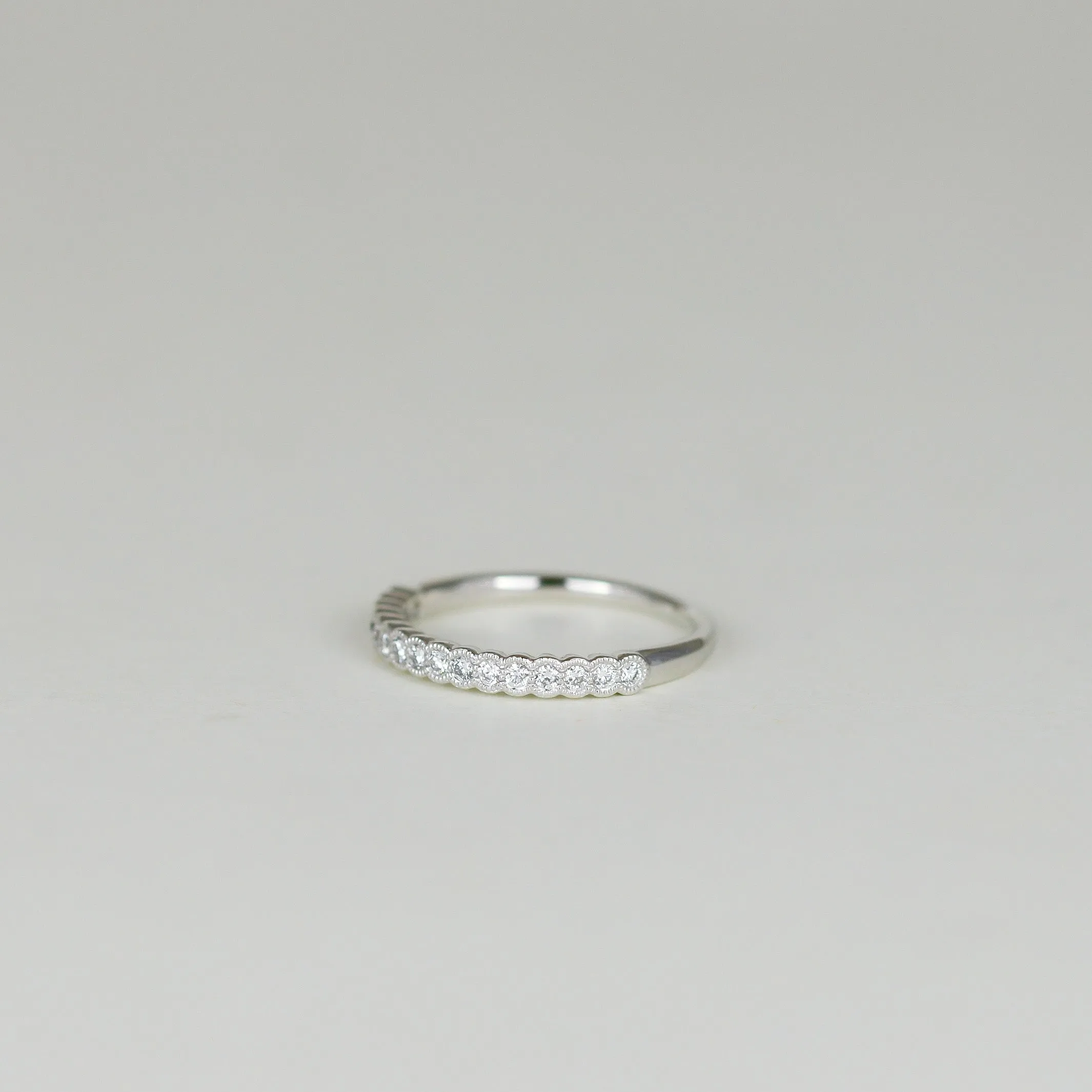 Platinum 0.20ct Round Brilliant Diamond Scalloped Edge Half Eternity Ring
